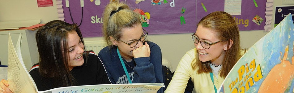 Childcare students reading books